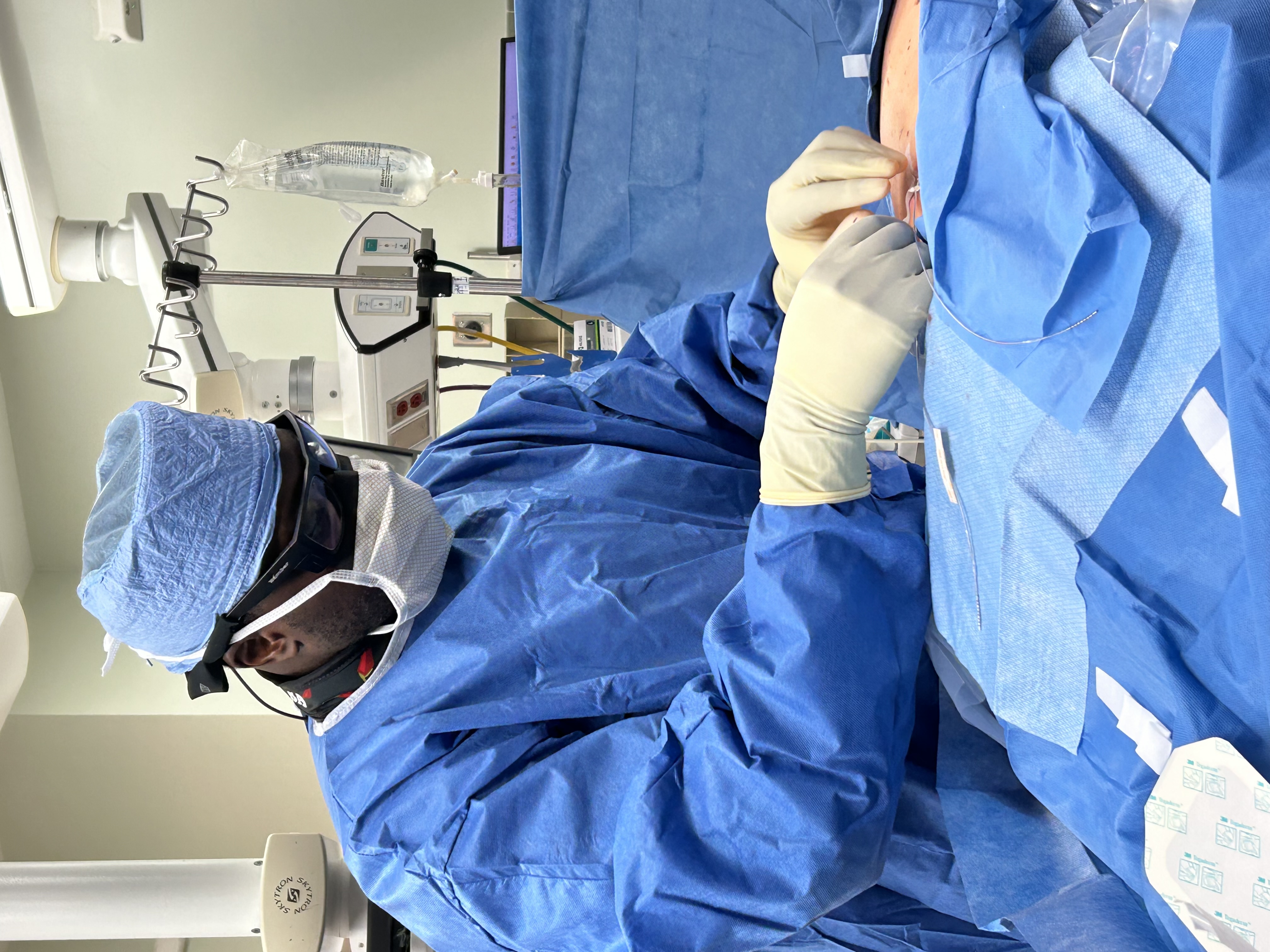Boris Anyama working in an operating room as an anesthesiology physician.
